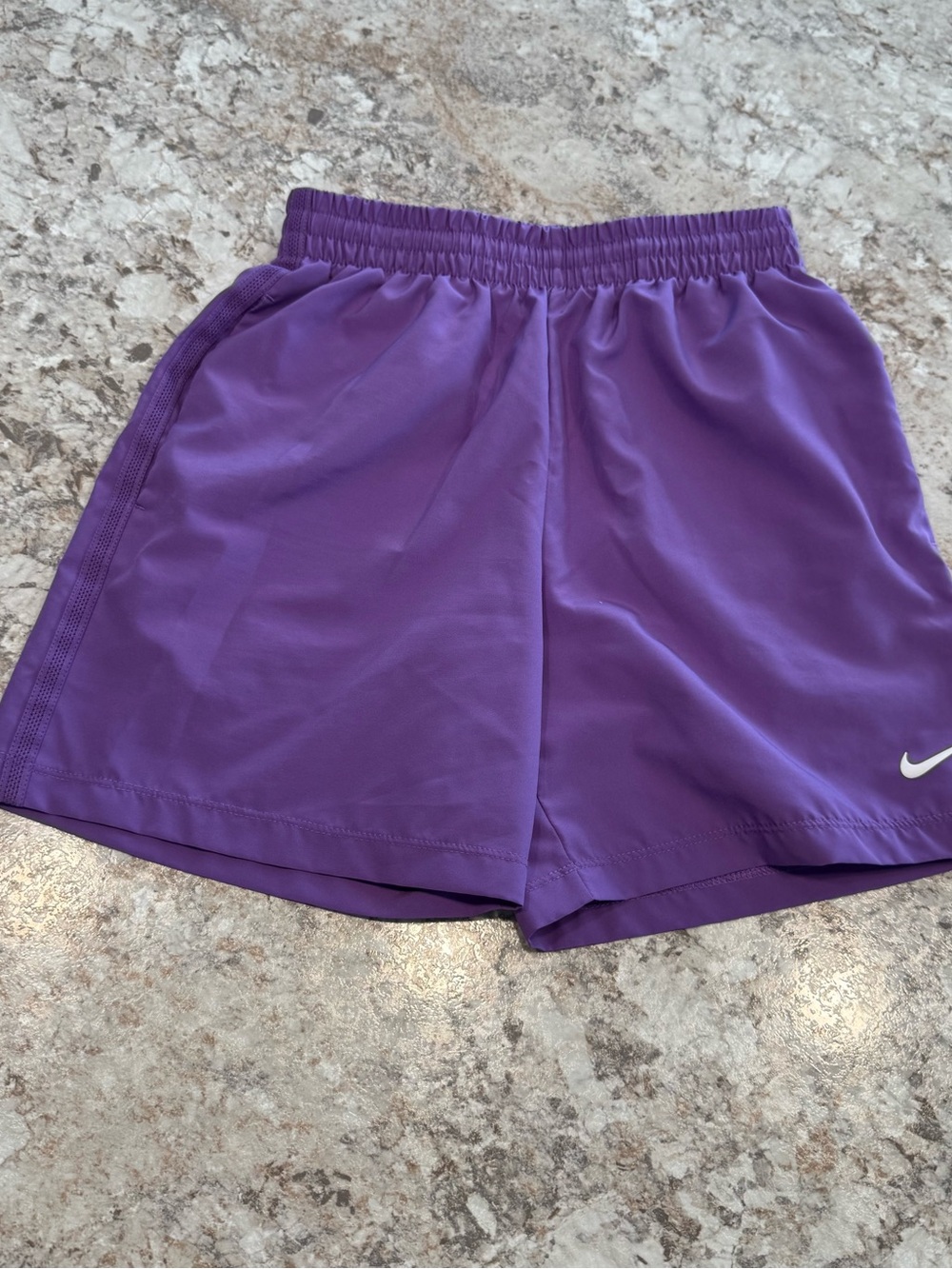 Nike Women's Vibrant Purple Athletic Shorts with White Swoosh